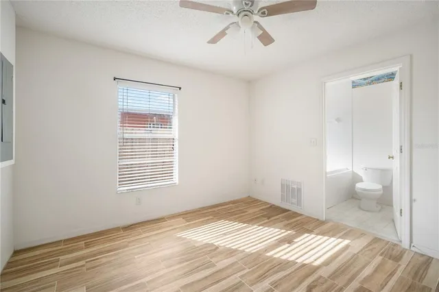 a view of a bedroom and a window