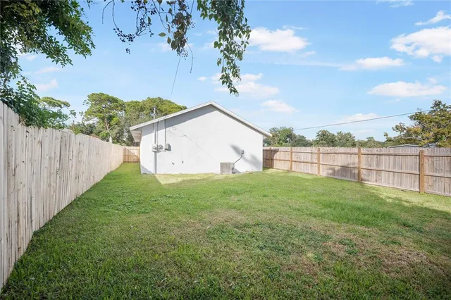 a view of backyard with green space