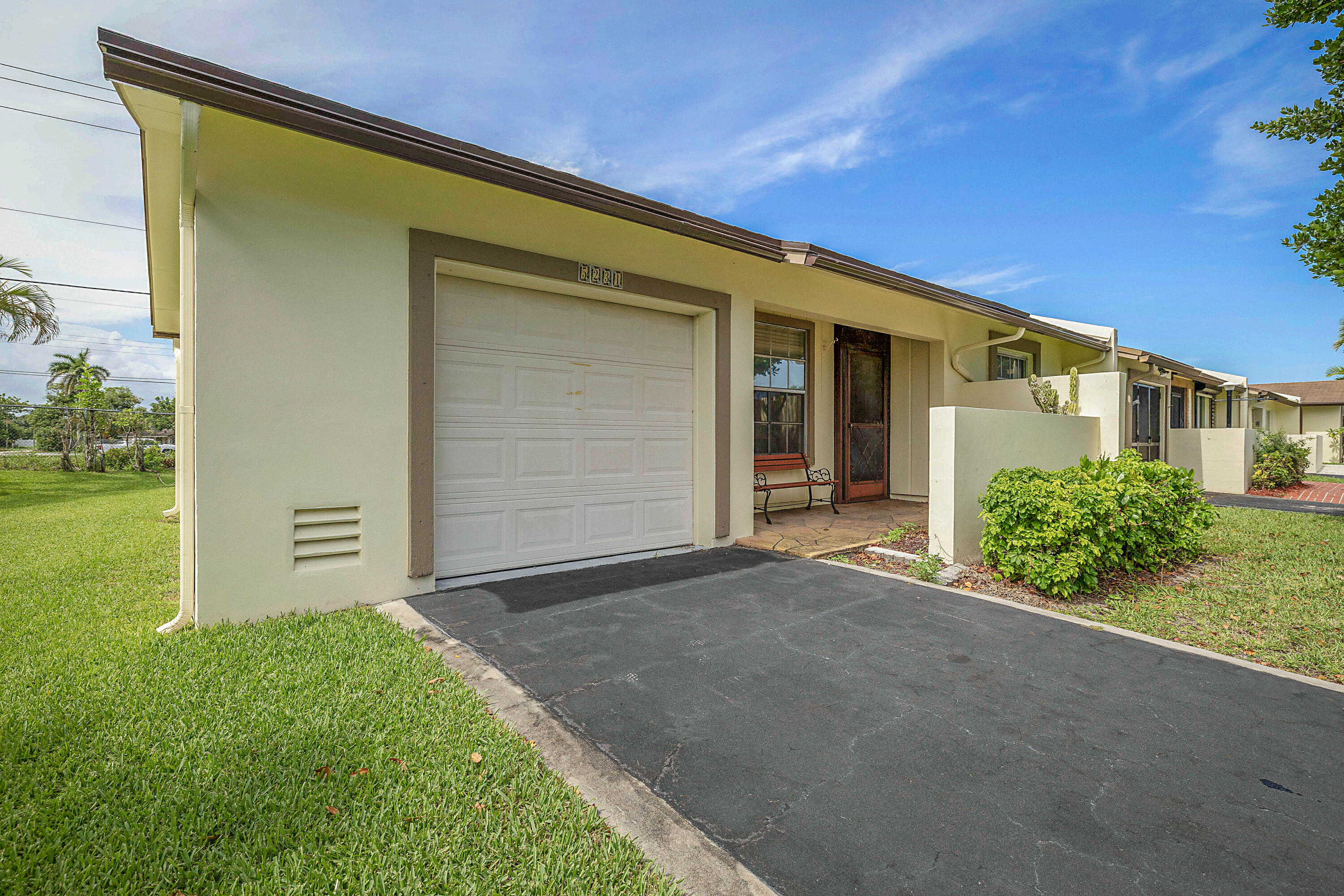 5231 Copperleaf Circle Delray Beach, FL 33484 - Photo 28 of 31 front view of a house with a yard
