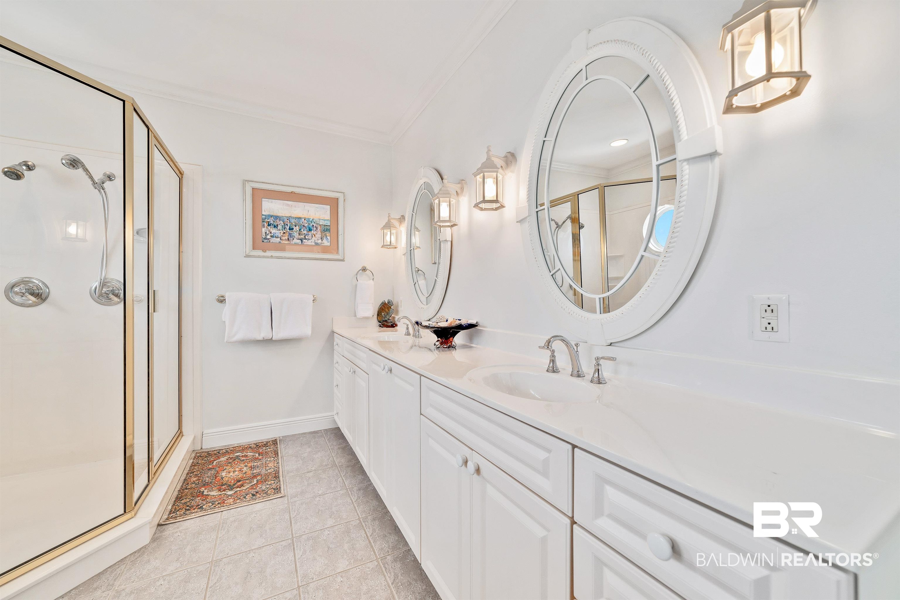 24513 Gulf Bay Road Orange Beach, AL 36561 - Photo 24 of 52 Bathroom with a shower with door, ornamental molding, dual bowl vanity, and tile patterned floors
