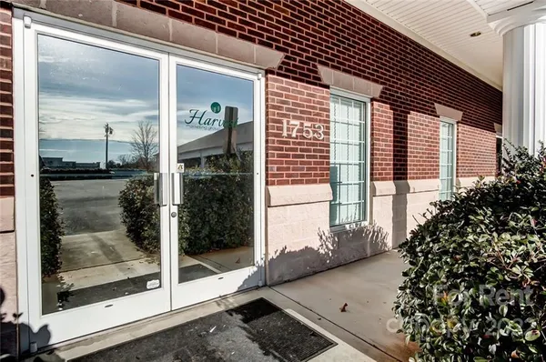 a view of a balcony with a potted plant