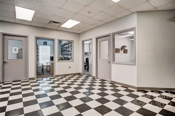 a view of a big room with a black and white checkered floor