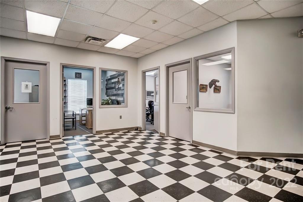 1753 Old Earnhardt Road Kannapolis, NC 28083 - Photo 6 of 9 a view of a big room with a black and white checkered floor