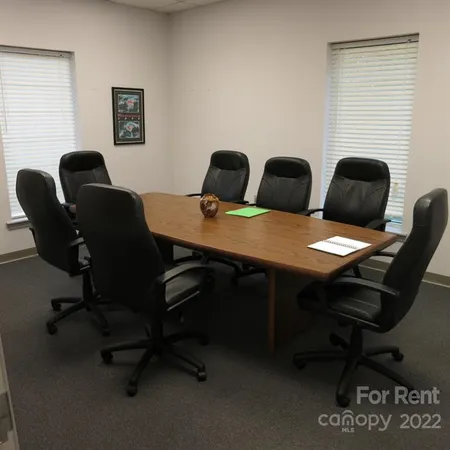 a view of a workspace with furniture