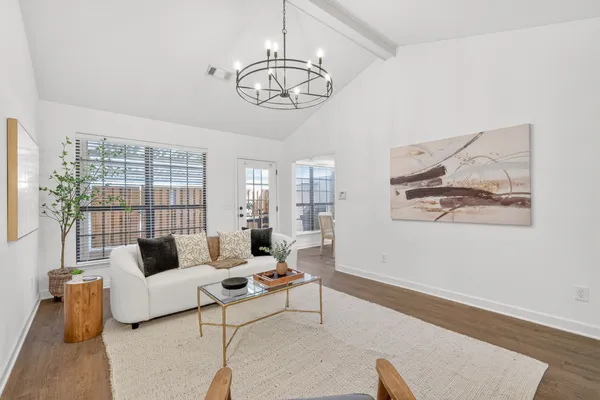 a view of a livingroom with furniture and a fireplace