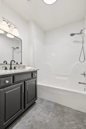a view of a livingroom with wooden floor and a fireplace