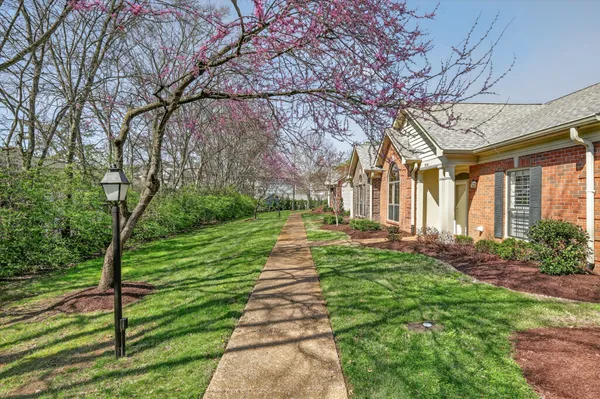 a view of a room with furniture and a window