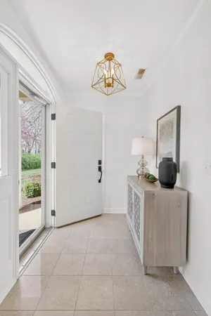 a bedroom with furniture and a chandelier