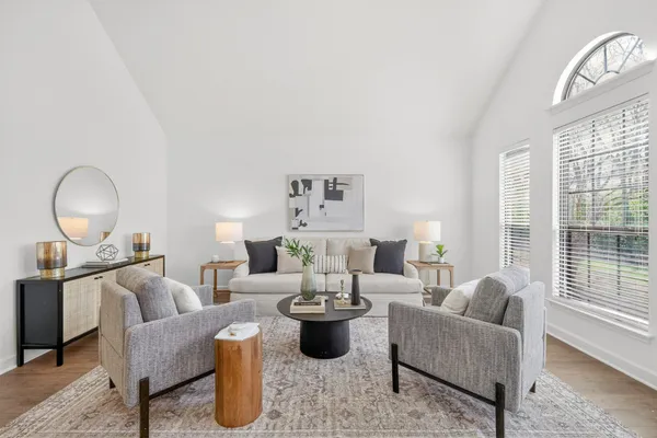 a living room with furniture and a large window