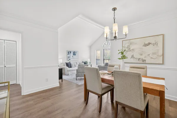 a view of a dining room with furniture window and wooden floor