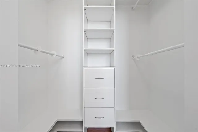 a view of an empty walk in closet