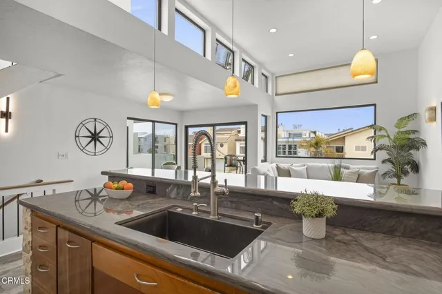 a kitchen with a sink and a large window