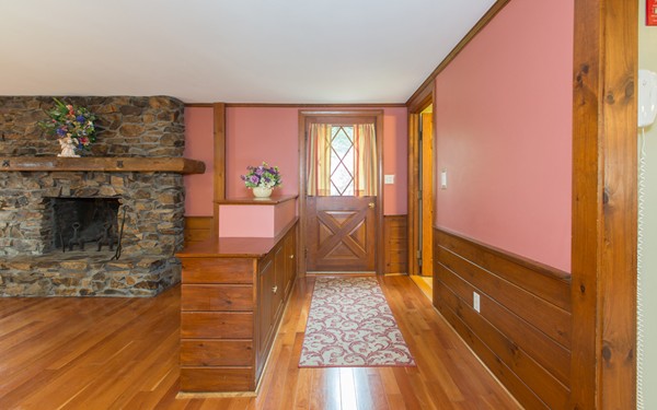 89 Lake Attitash Road Amesbury, MA 01913 - Photo 15 of 29 a living room with furniture and a fireplace