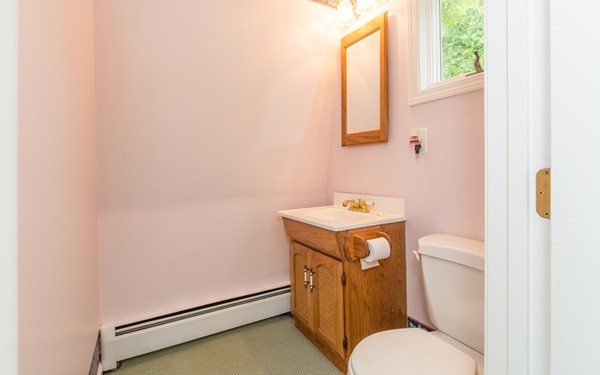 89 Lake Attitash Road Amesbury, MA 01913 - Photo 20 of 29 a bathroom with a sink and a toilet