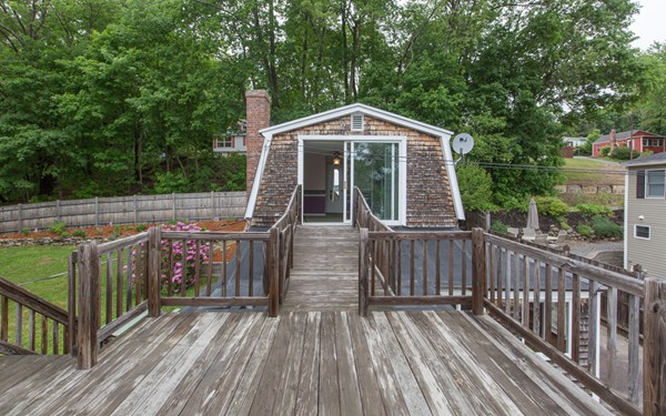 89 Lake Attitash Road Amesbury, MA 01913 - Photo 22 of 29 a view of a wooden deck with a yard