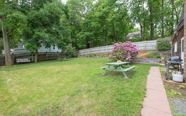 89 Lake Attitash Road Amesbury, MA 01913 - Photo 24 of 29 a view of a backyard with a garden