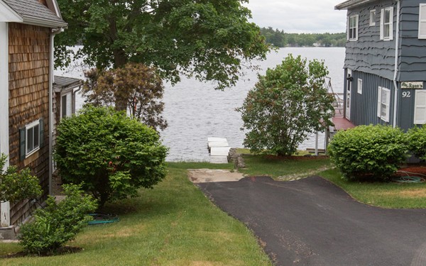 89 Lake Attitash Road Amesbury, MA 01913 - Photo 26 of 29 a view of a house next to a yard