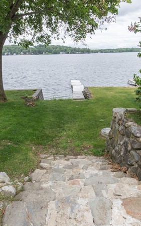 89 Lake Attitash Road Amesbury, MA 01913 - Photo 27 of 29 a view of a lake with houses in the back