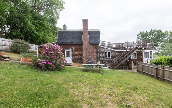 89 Lake Attitash Road Amesbury, MA 01913 - Photo 29 of 29 a view of a house with a yard and sitting area