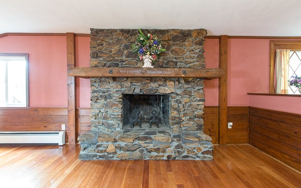 89 Lake Attitash Road Amesbury, MA 01913 - Photo 9 of 29 a living room with a fireplace