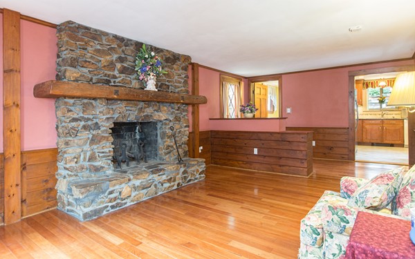 89 Lake Attitash Road Amesbury, MA 01913 - Photo 10 of 29 a living room with furniture and a fireplace
