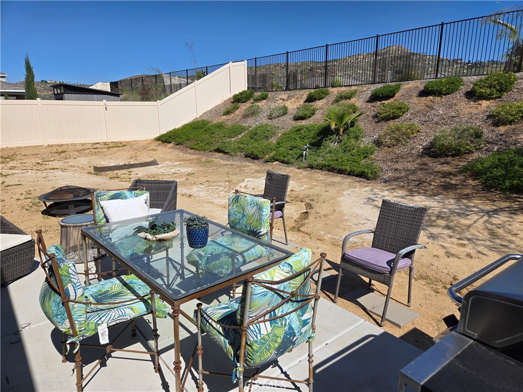 7900 Raincross Court Riverside, CA 92507 - Photo 19 of 21 a view of a terrace with furniture and stove