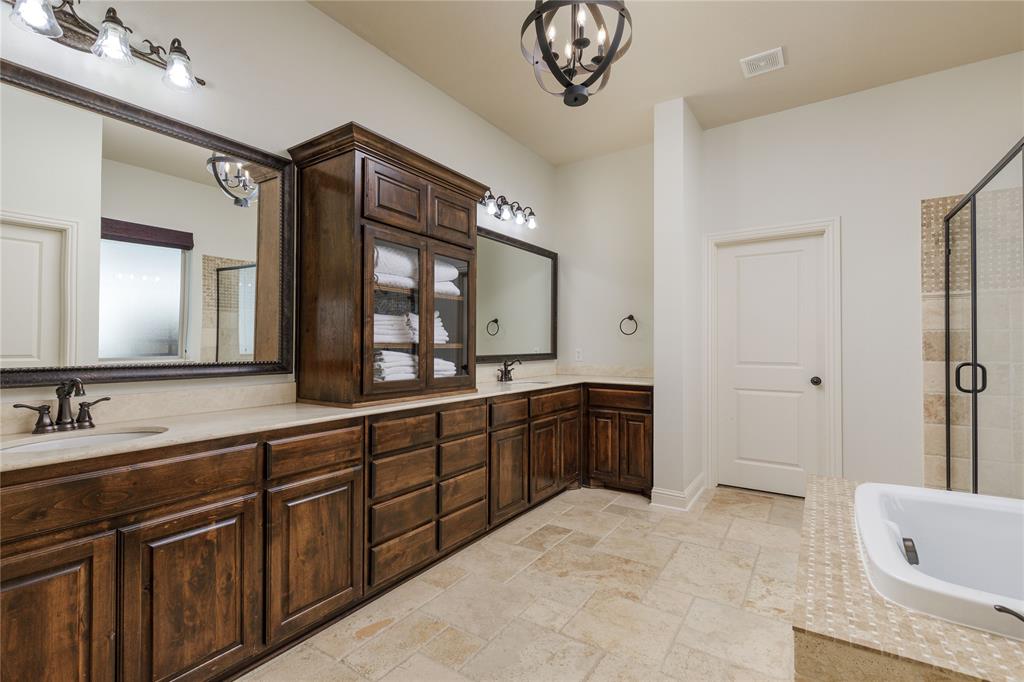 2205 State Boulevard McKinney, TX 75071 - Photo 16 of 40 Primary bathroom with separate vanities.