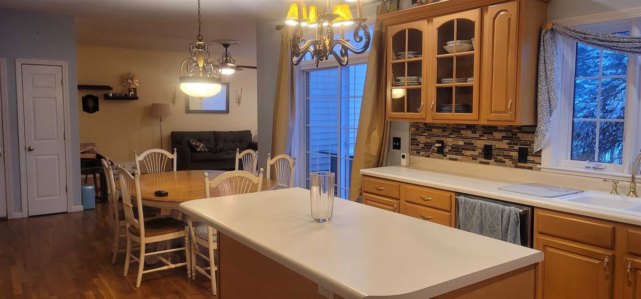 39 Brookside Lane Lagrangeville, NY 12540 - Photo 14 of 30 a large kitchen with a table and chairs