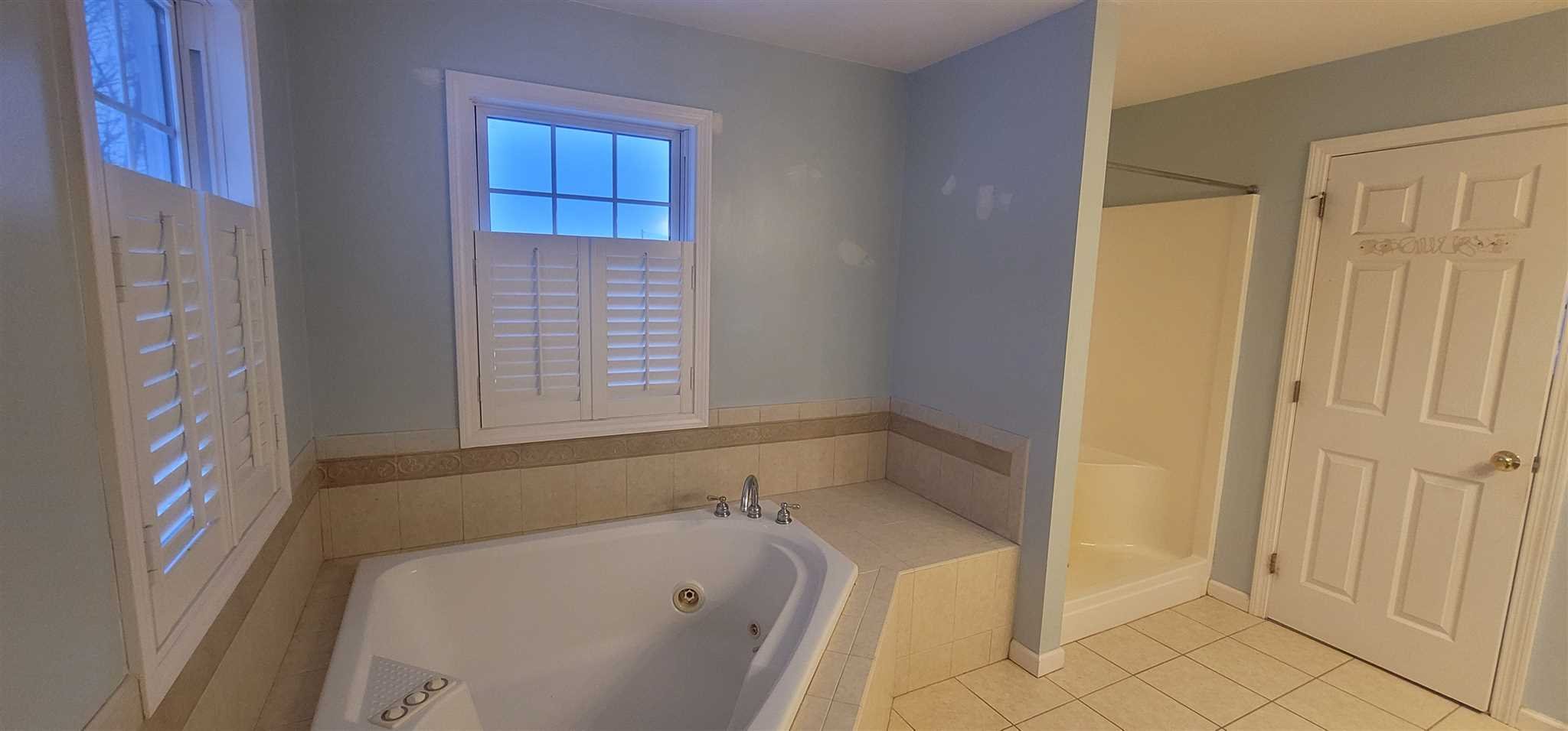 39 Brookside Lane Lagrangeville, NY 12540 - Photo 24 of 30 a bathroom with a bathtub and shower