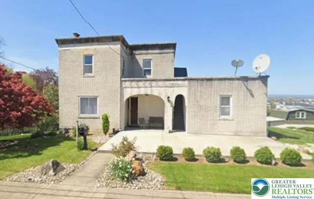 a view of open kitchen with cabinets and potted plant