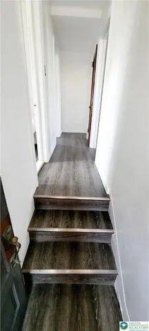 a stove top oven sitting inside of a kitchen