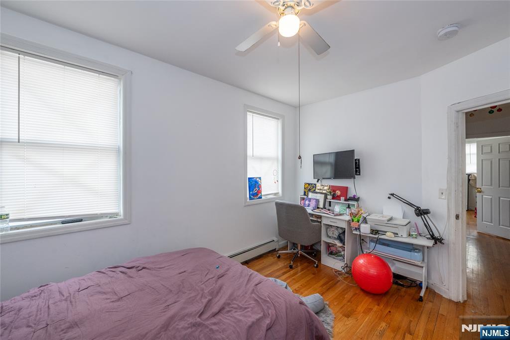 65 Grove Street Bloomfield, NJ 07003 - Photo 11 of 50 a bedroom with a bed closet and a window