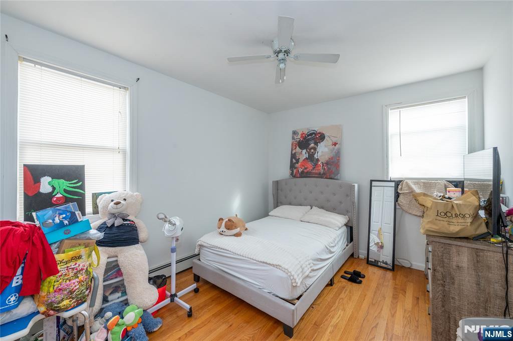 65 Grove Street Bloomfield, NJ 07003 - Photo 12 of 50 a bedroom with a bed furniture and a window