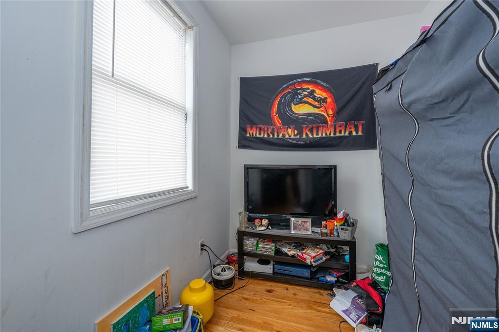 65 Grove Street Bloomfield, NJ 07003 - Photo 14 of 50 a room with furniture and a flat screen tv