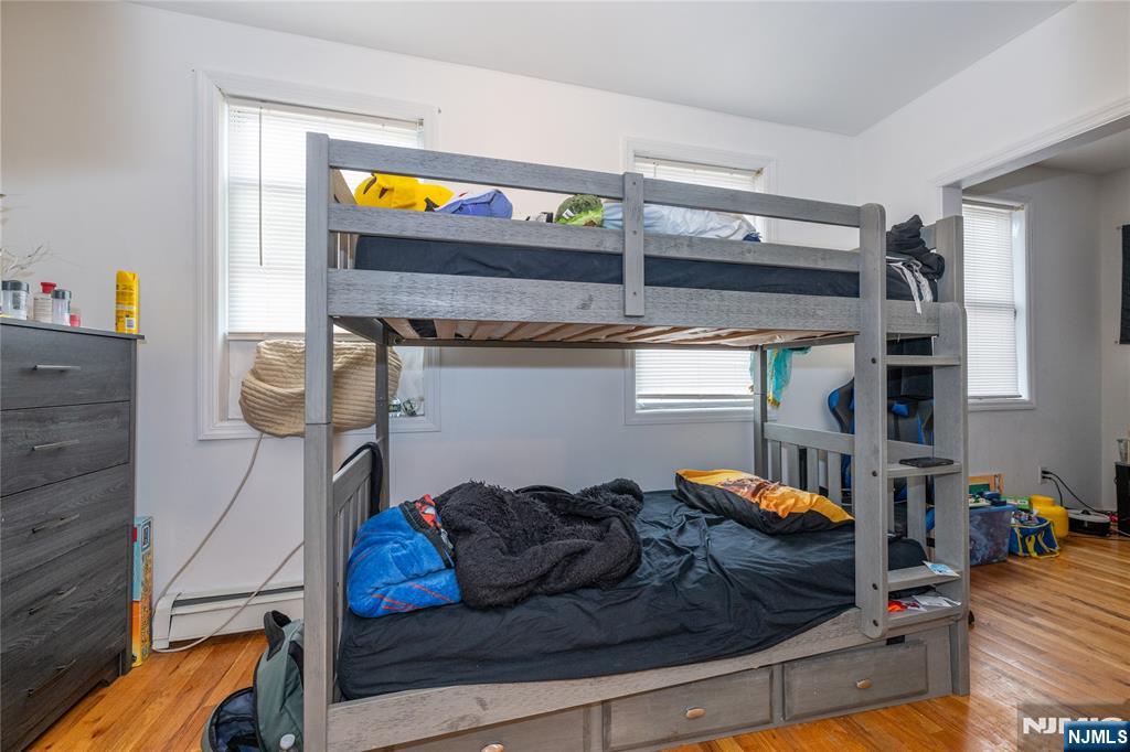 65 Grove Street Bloomfield, NJ 07003 - Photo 15 of 50 a living room with furniture and a bed