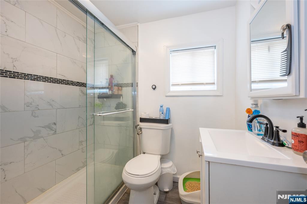 65 Grove Street Bloomfield, NJ 07003 - Photo 16 of 50 a bathroom with a sink and a toilet