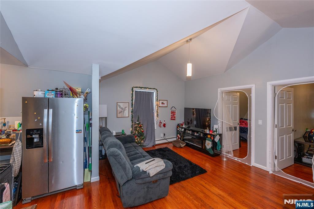 65 Grove Street Bloomfield, NJ 07003 - Photo 20 of 50 a living room with furniture and a flat screen tv