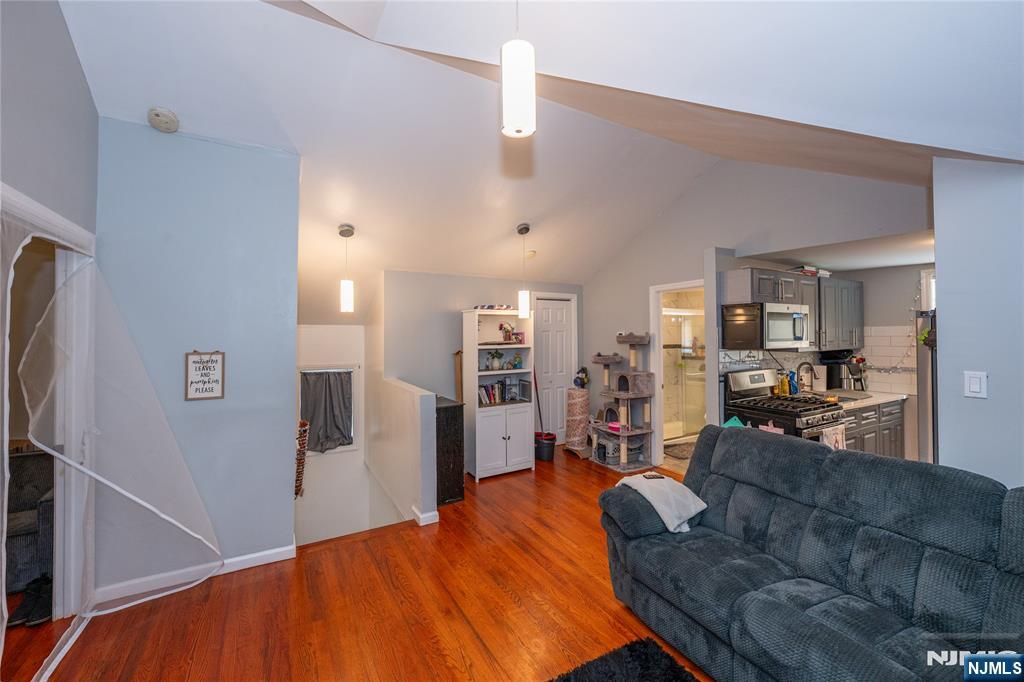65 Grove Street Bloomfield, NJ 07003 - Photo 22 of 50 a living room with furniture and a flat screen tv