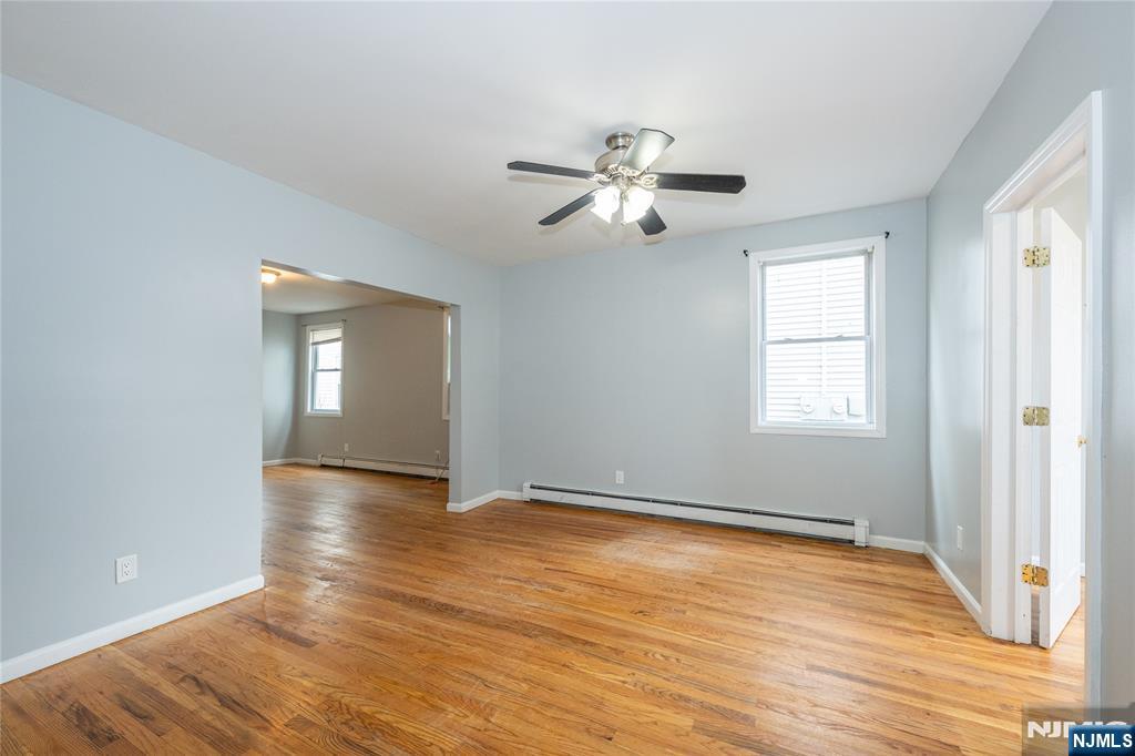 65 Grove Street Bloomfield, NJ 07003 - Photo 27 of 50 a view of empty room with wooden floor and fan