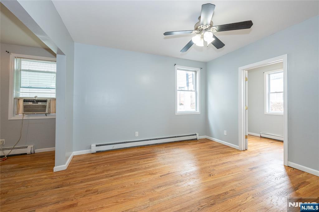 65 Grove Street Bloomfield, NJ 07003 - Photo 28 of 50 a view of an empty room with wooden floor and a window
