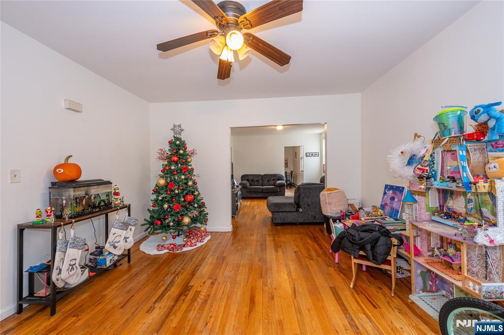 65 Grove Street Bloomfield, NJ 07003 - Photo 3 of 50 a living room with furniture and a wooden floor