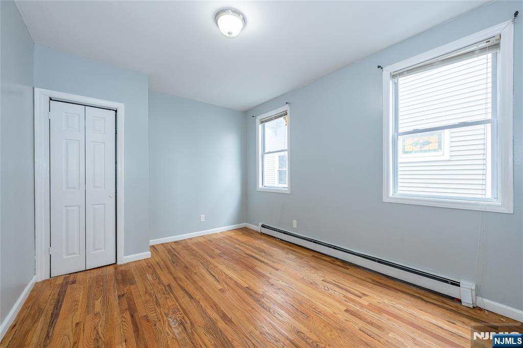 65 Grove Street Bloomfield, NJ 07003 - Photo 40 of 50 a bedroom with a bed and a window
