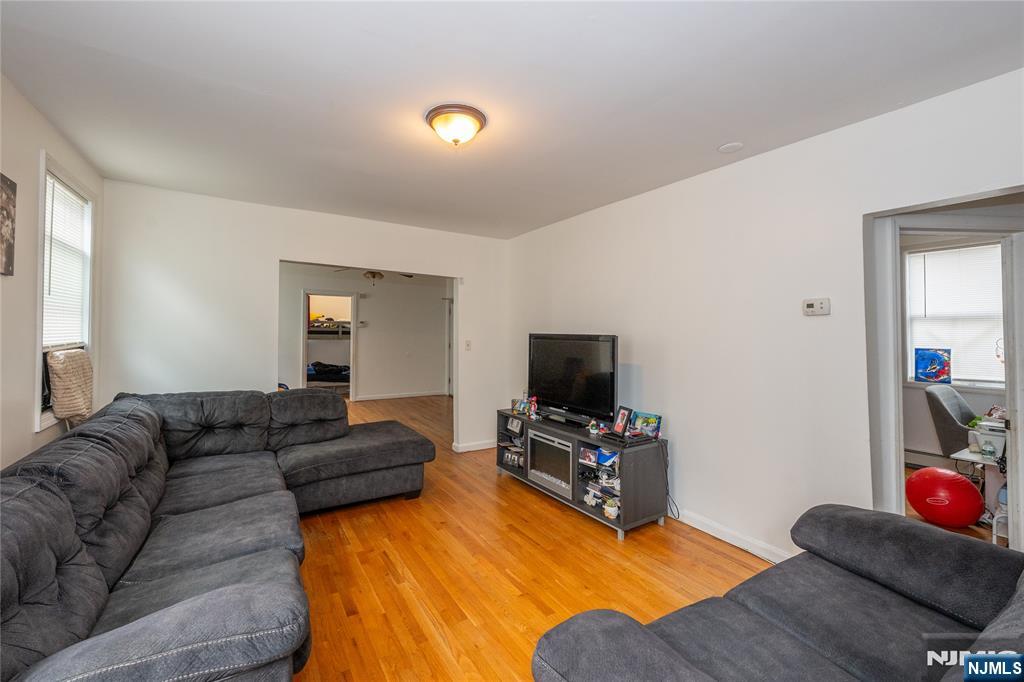 65 Grove Street Bloomfield, NJ 07003 - Photo 4 of 50 a living room with furniture and a flat screen tv