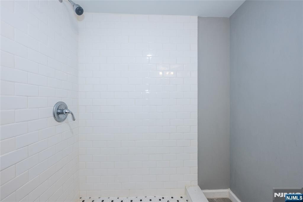 65 Grove Street Bloomfield, NJ 07003 - Photo 44 of 50 a bathroom with a shower