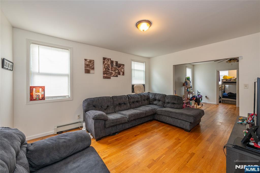 65 Grove Street Bloomfield, NJ 07003 - Photo 5 of 50 a living room with furniture and a flat screen tv