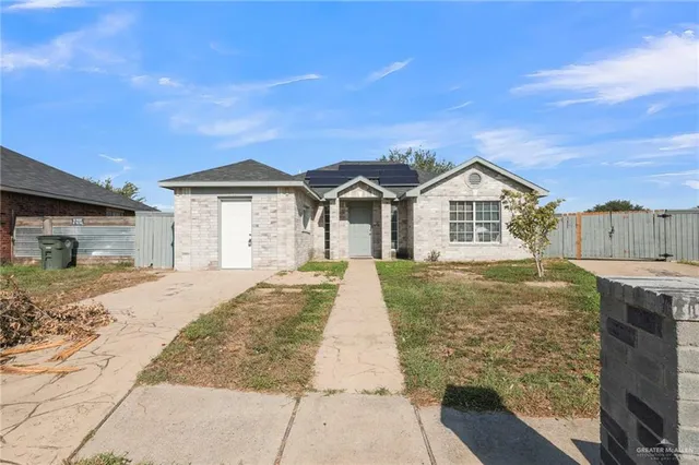 a large kitchen with kitchen island a sink stainless steel appliances and cabinets