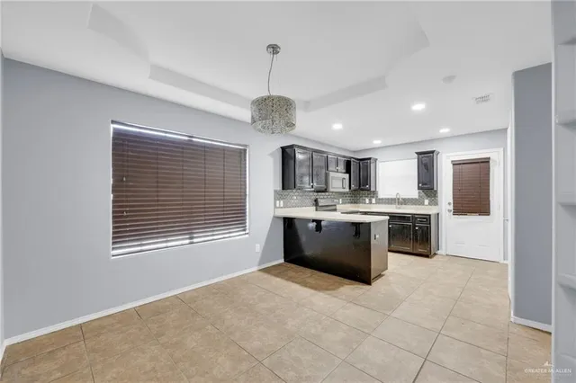 a view of a kitchen with a sink and dishwasher