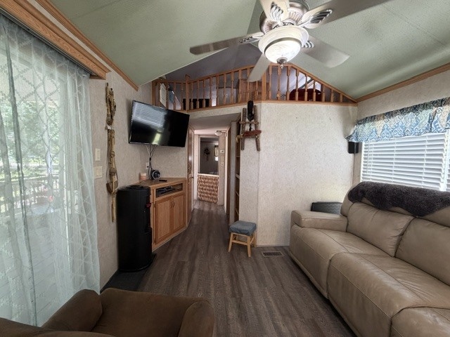 2795 East 28th Road Marseilles, IL 61341 - Photo 13 of 75 a living room with furniture a flat screen tv and a floor to ceiling window