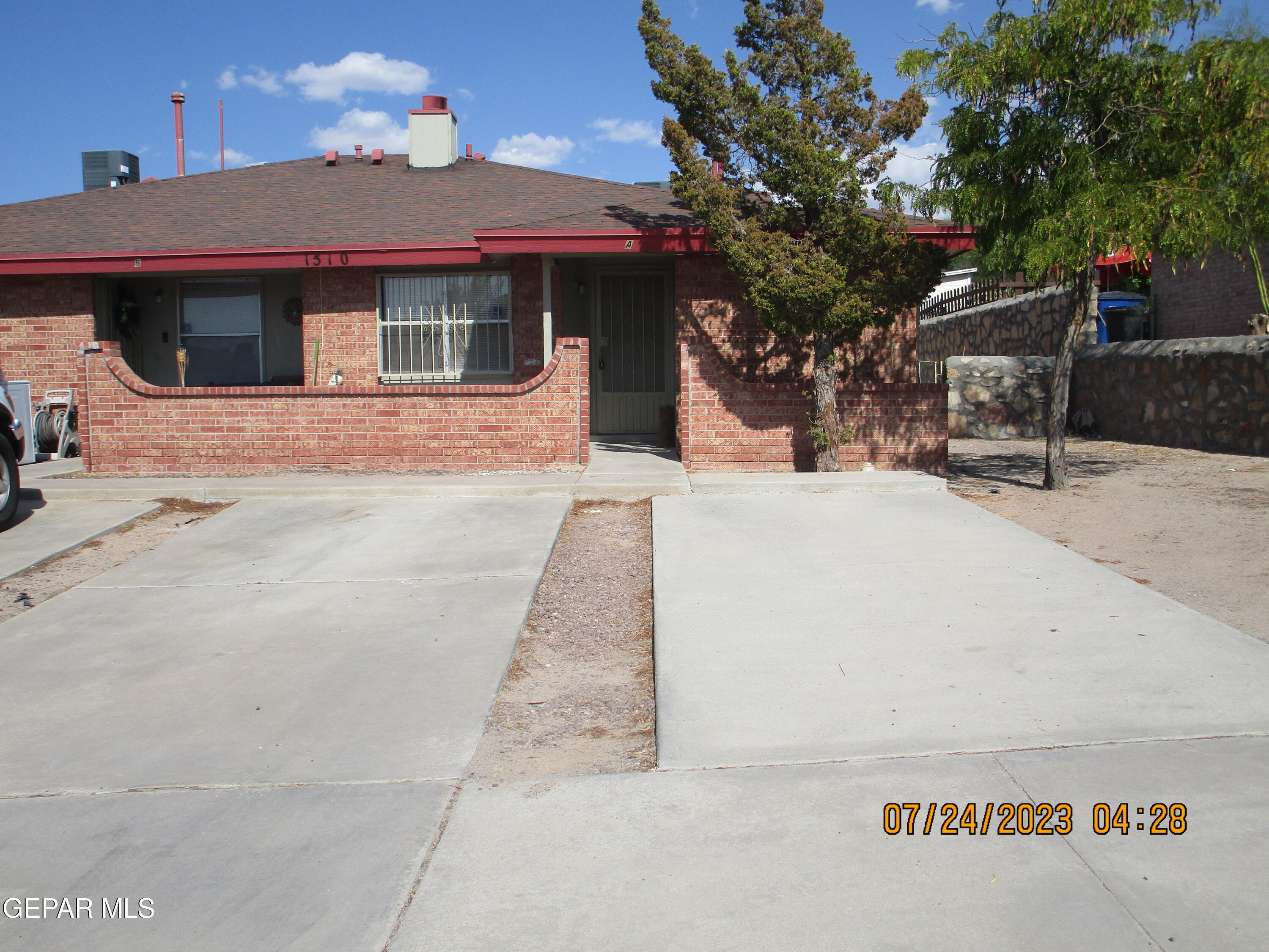 1510 Greg Powers Drive, Unit A El Paso, TX 79936 - Photo 1 of 1 a front view of a house with a tree