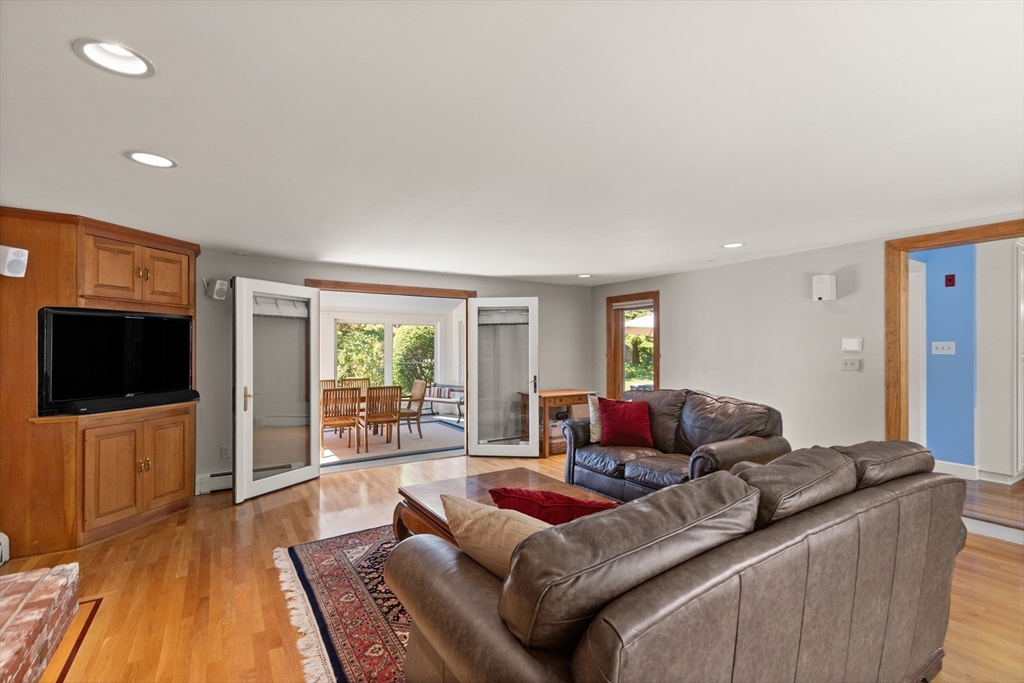 148 Ipswich Road Boxford, MA 01921 - Photo 20 of 42 a living room with furniture and a flat screen tv